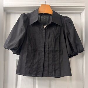 Banana Republic Chic Black Vida Poplin Top - Sz Small
Stylish/ casual
NWOT